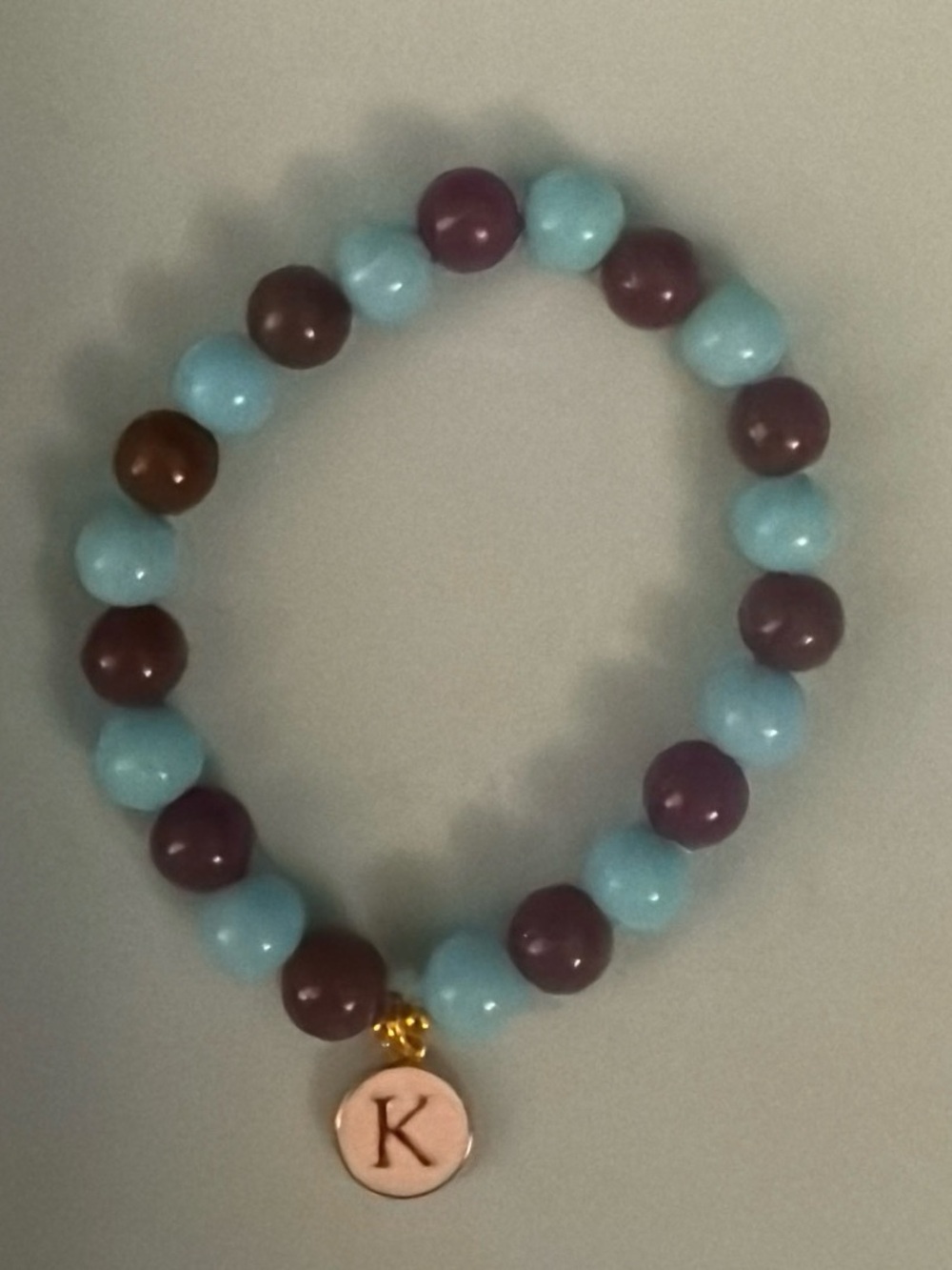 Initial ‘K’ Charm Beaded Stretch Bracelet in Light Blue and Plum